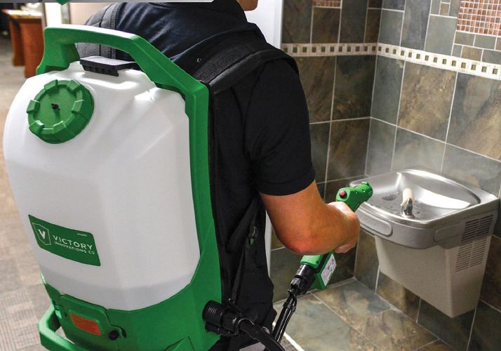 Disinfection Cleaning Services in Dayton – janitorial worker sanitizing drinking fountain
