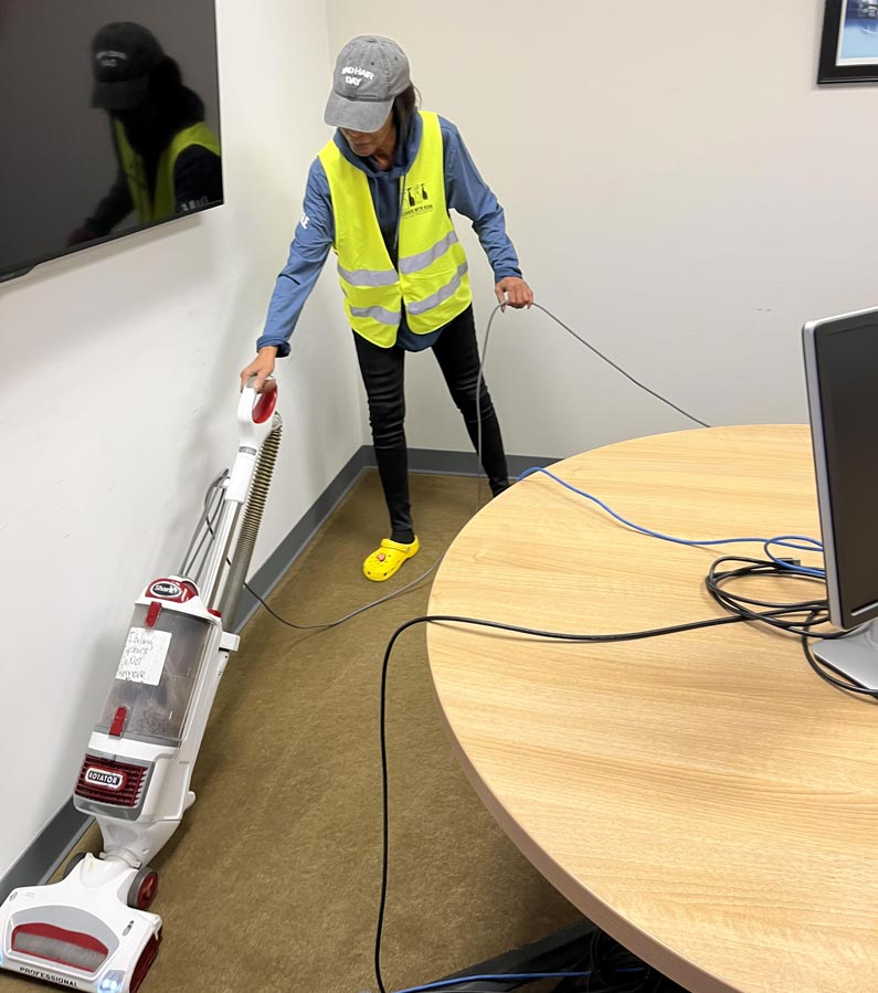 Professional cleaner vacuuming office of Dayton business