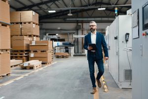 Columbus facility manager walking through a clean Columbus-area commercial building with a tablet